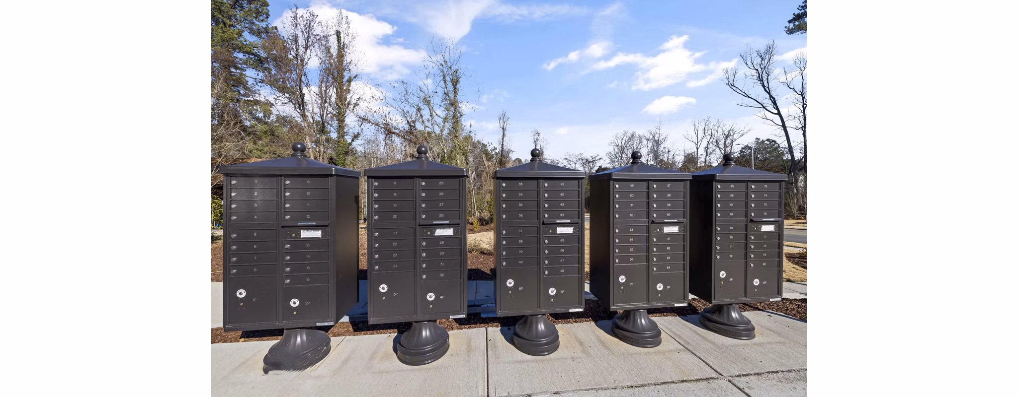 Mail room with secure package lockers at Ashford Townes Apartments