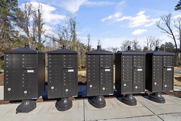 Mail room with secure package lockers at Ashford Townes Apartments