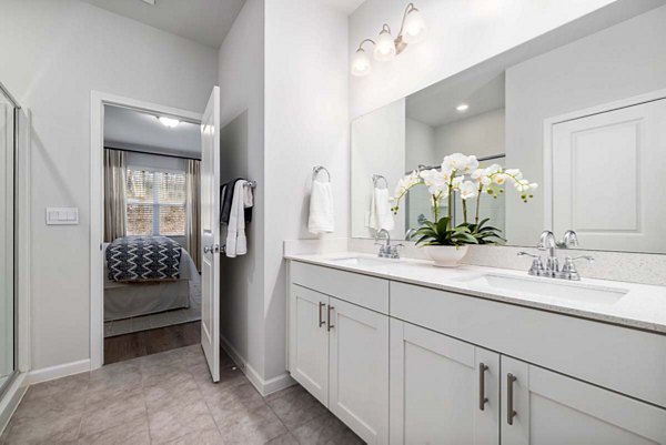 Bathroom with sleek fixtures and elegant tiles at Ashford Townes Apartments