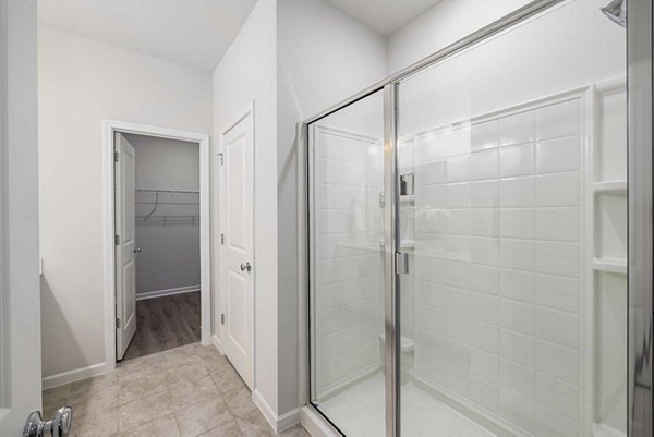 Modern bathroom featuring elegant fixtures at Ashford Townes Apartments