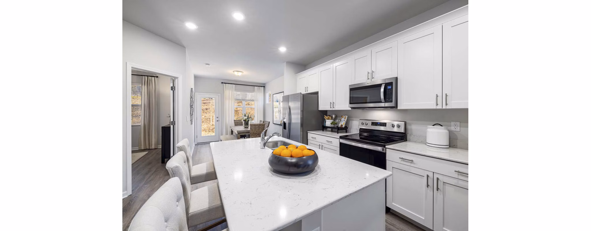 Modern kitchen with stainless steel appliances at Ashford Townes Apartments