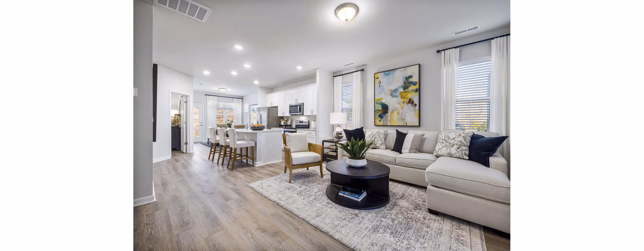 Bright living room with modern furnishings at Ashford Townes Apartments