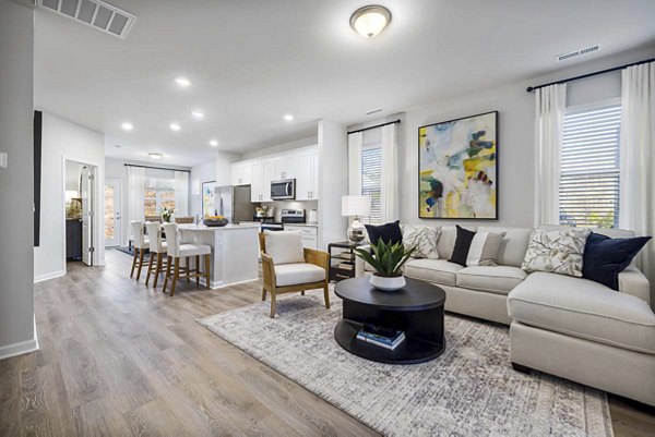 Bright living room with modern furnishings at Ashford Townes Apartments