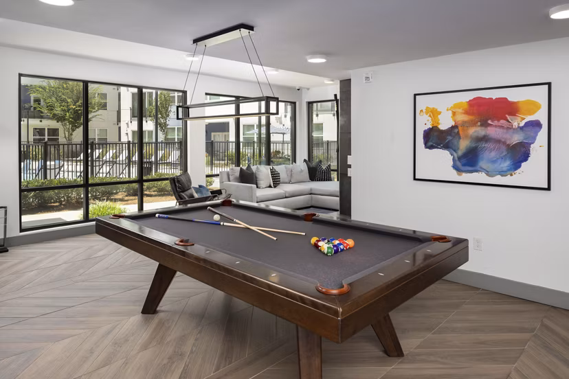 Clubhouse with modern design and seating at Marchon Apartments luxury community