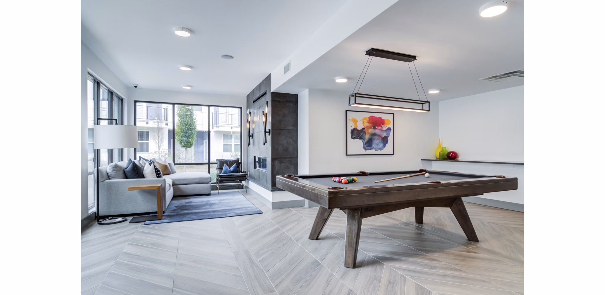 Clubhouse with modern design and seating at Marchon Apartments luxury community