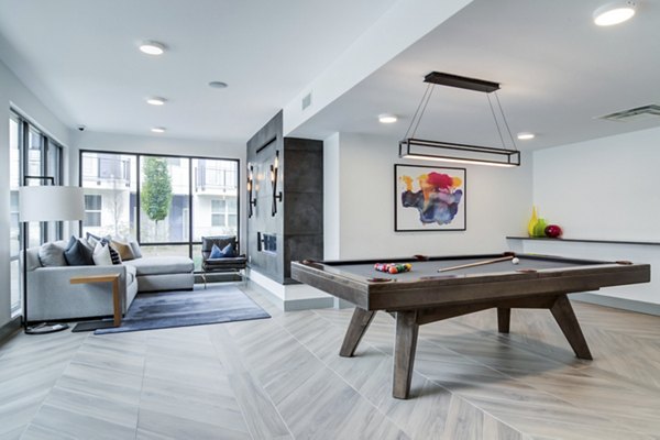Clubhouse with modern design and seating at Marchon Apartments luxury community