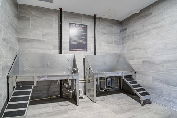 Modern outdoor patio with stylish seating at Marchon Apartments in lively urban setting