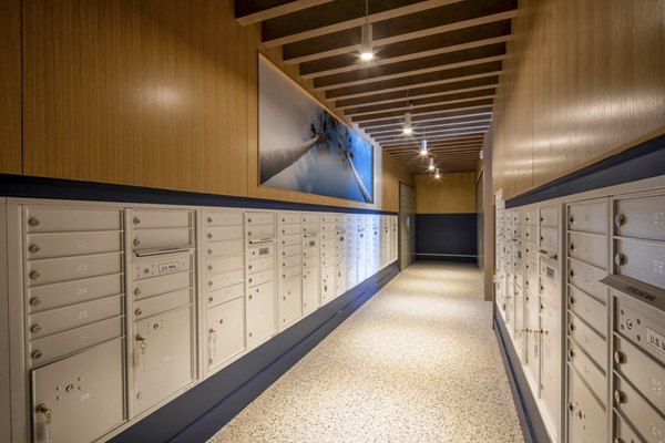 Mail room at Azul North Park Apartments with secure package lockers