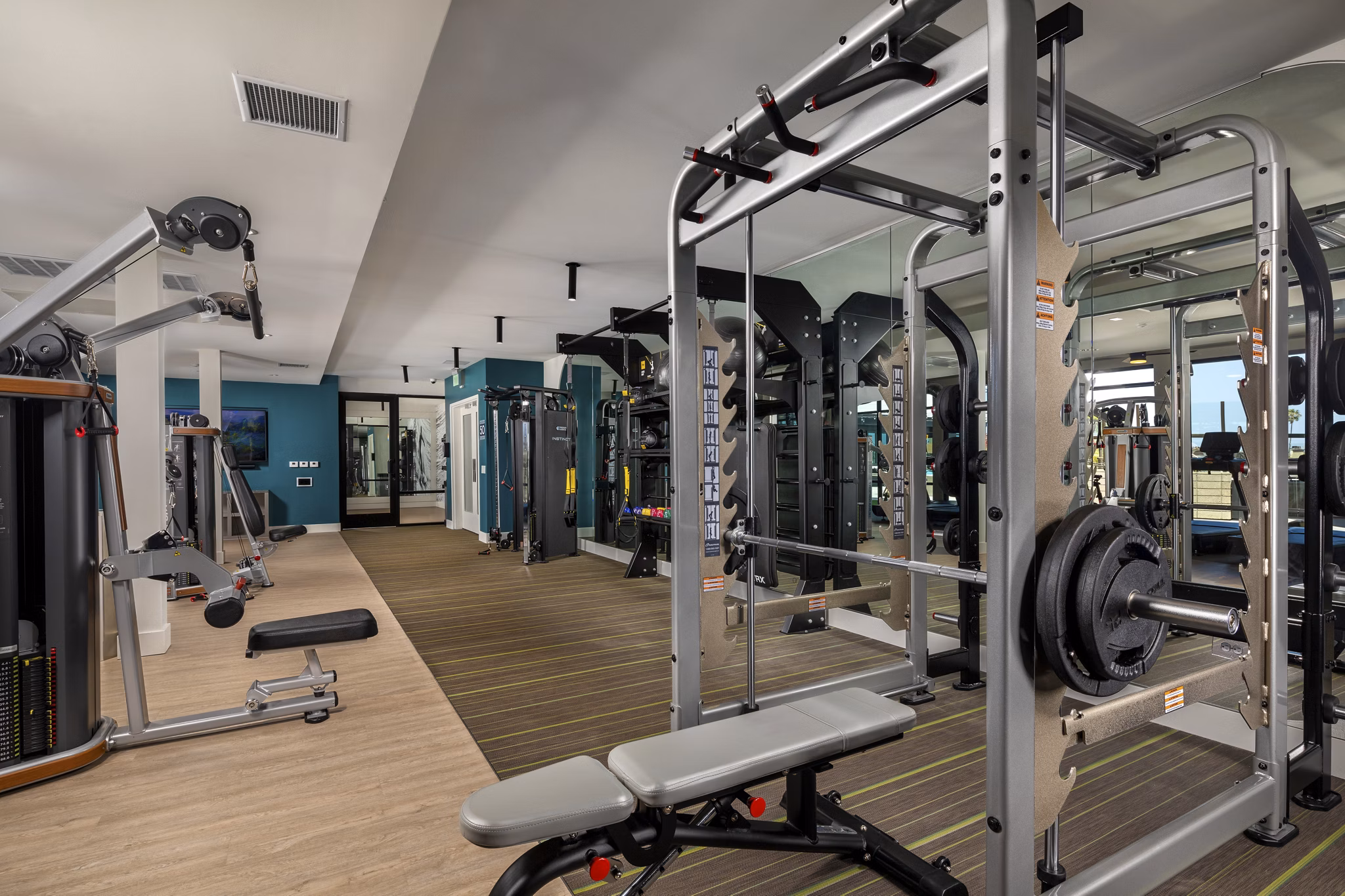Fitness center with modern equipment at Azul North Park Apartments, ideal for health enthusiasts seeking a dynamic workout experience