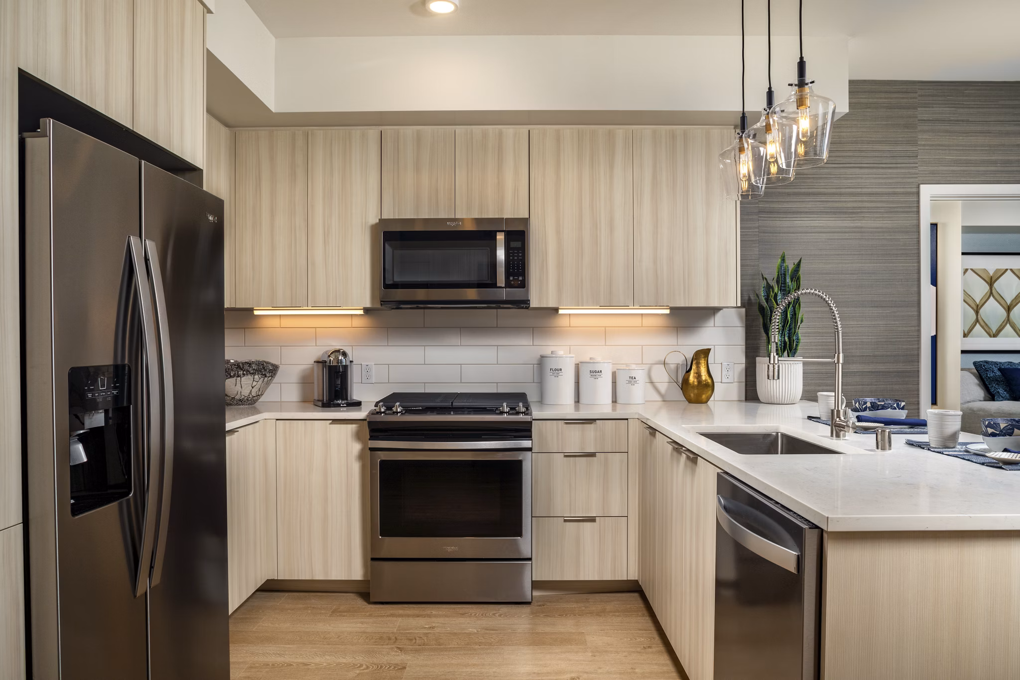 Sleek modern kitchen with stainless steel appliances in Azul North Park Apartments