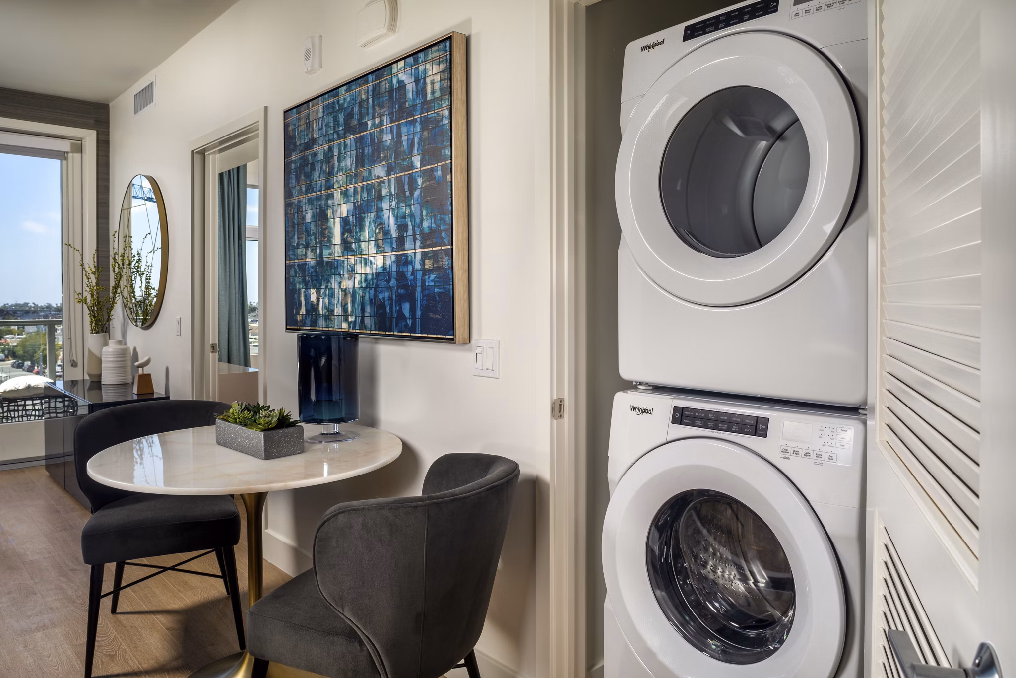 Laundry room with modern appliances in Azul North Park Apartments: Greystar luxury apartments offering convenience and style