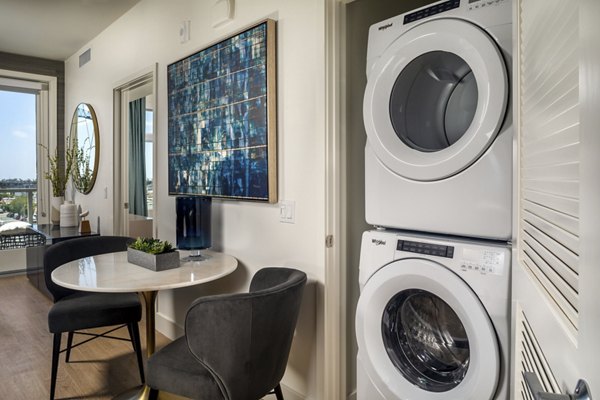 Laundry room with modern appliances in Azul North Park Apartments: Greystar luxury apartments offering convenience and style
