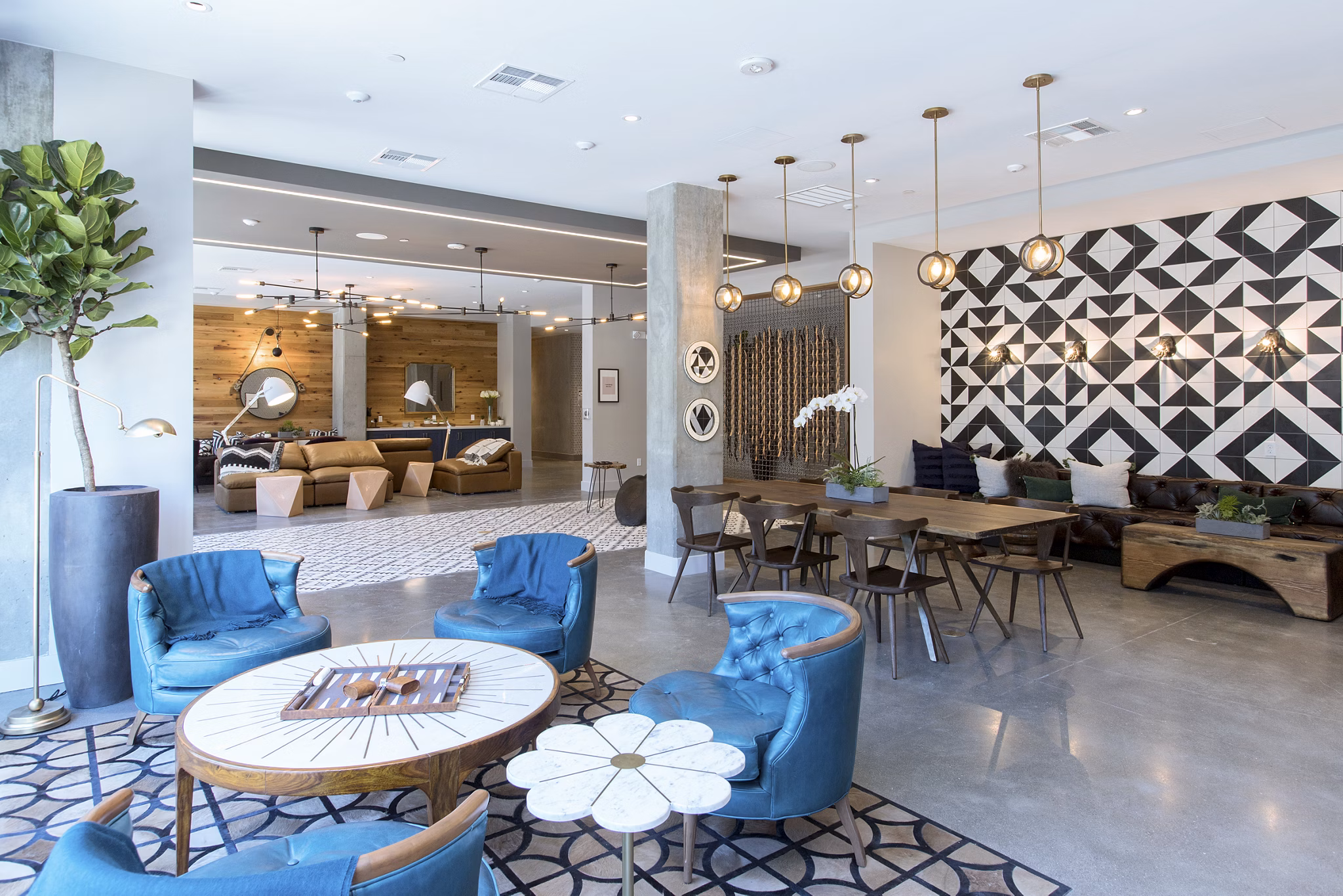 Clubhouse with modern seating and a billiards table at The Moran Apartments, luxury living in an exclusive community