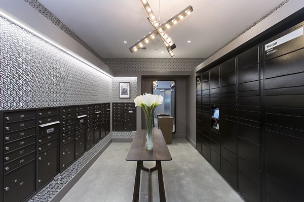 Mail room with secure package lockers at The Moran Apartments