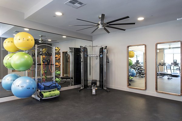 State-of-the-art fitness center with modern equipment at The Moran Apartments for luxury living