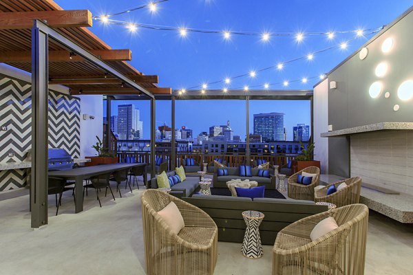 Rooftop deck with modern seating and greenery at The Moran Apartments