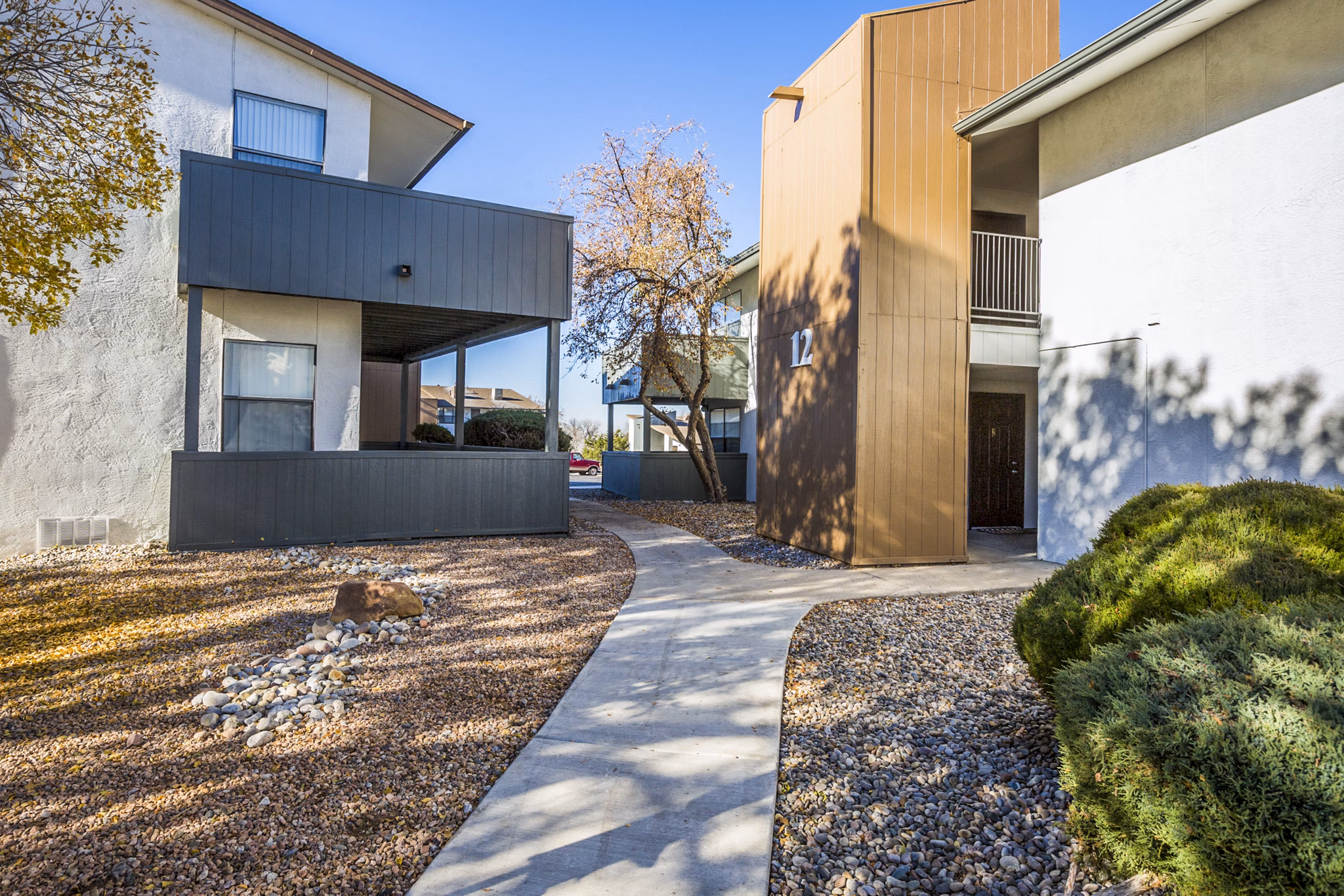 Canoan Village Apartments: Elegant mid-rise building in vibrant city neighborhood