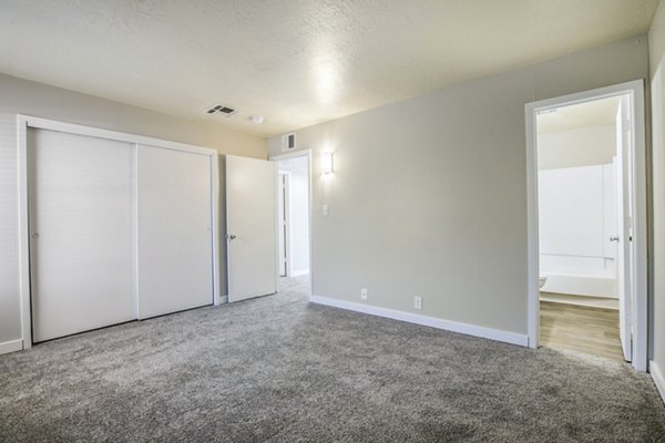 Comfortable bedroom with stylish decor at Canoan Village Apartments