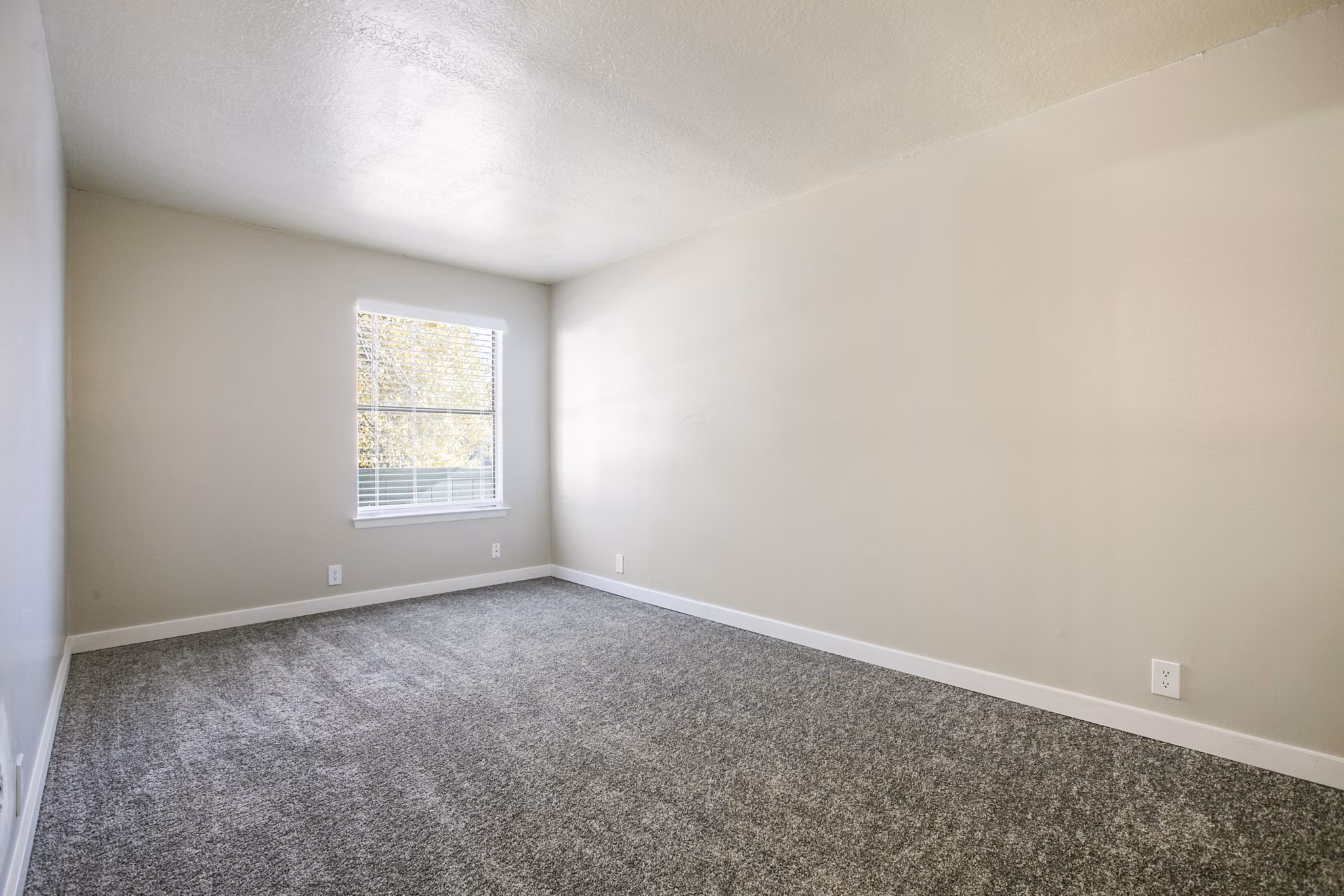 Bedroom featuring modern decor and spacious design at Canoan Village Apartments