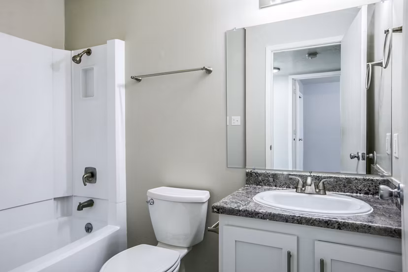 Bathroom with sleek fixtures and elegant design at Canoan Village Apartments