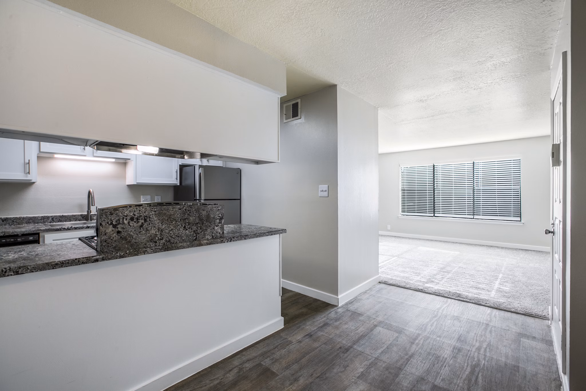 Dining room featuring elegant lighting and modern decor at Canoan Village Apartments in luxury setting