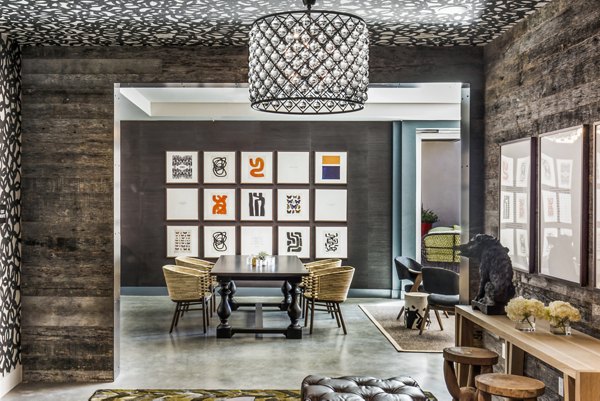 Modern clubhouse lobby with art installations at Telegraph Arts Apartments in vibrant residential community