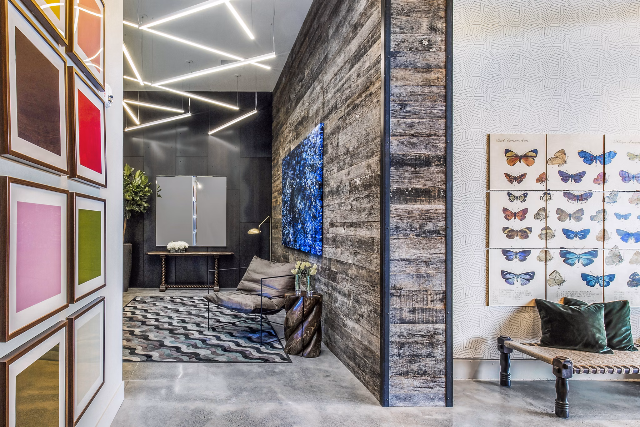 Welcoming clubhouse lobby with modern art and seating at Telegraph Arts Apartments