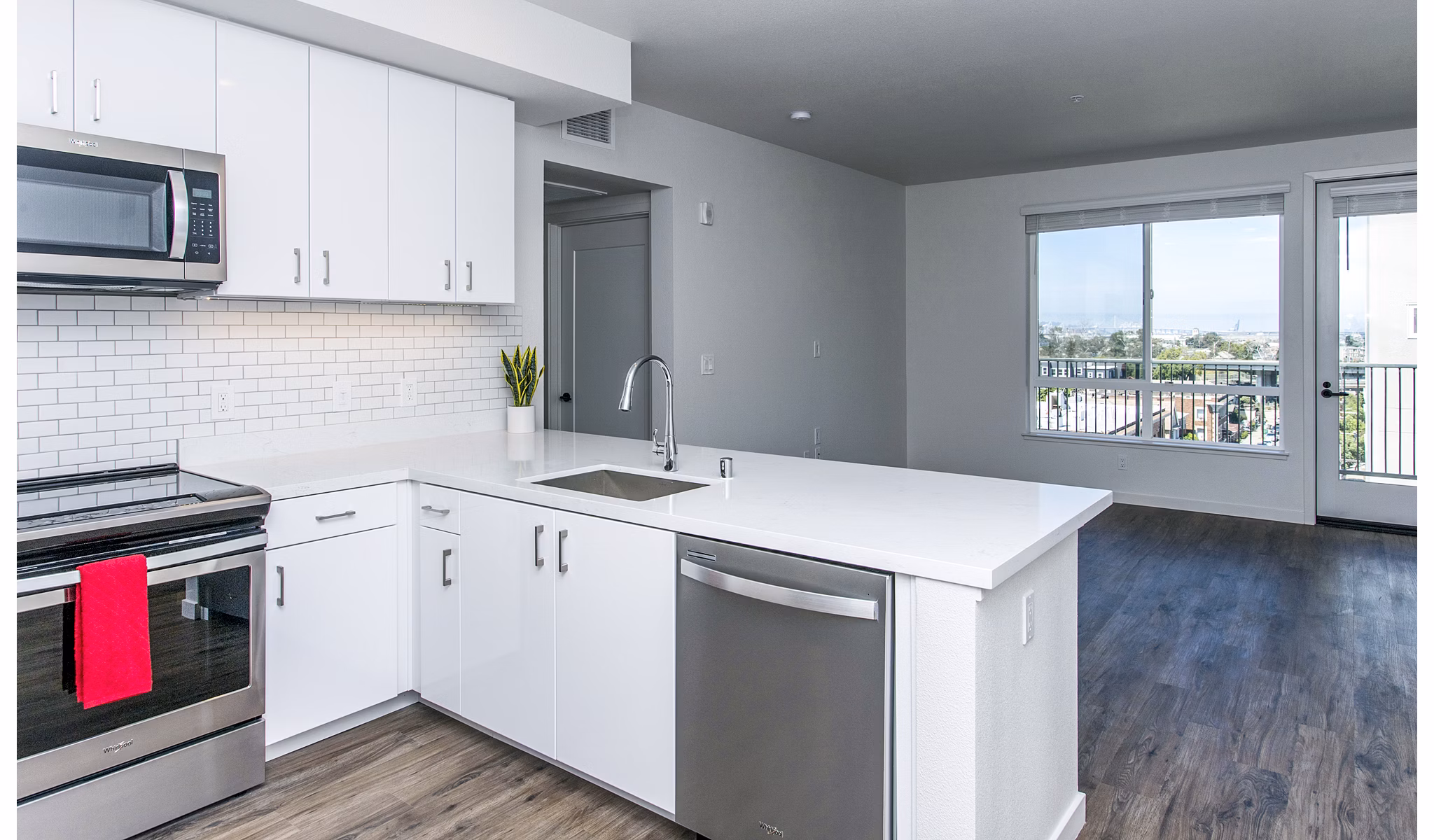 Modern kitchen with stainless steel appliances at Telegraph Arts Apartments