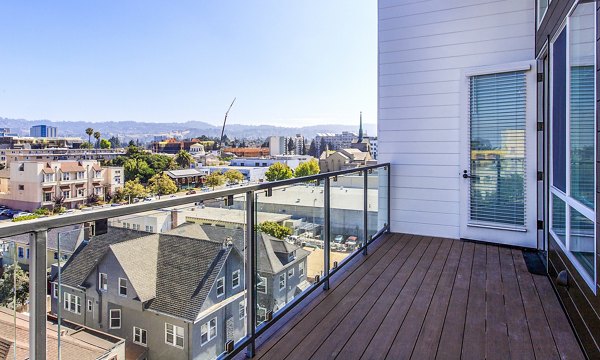 Patio with stylish outdoor seating at Telegraph Arts Apartments, perfect for relaxation and enjoying scenic views