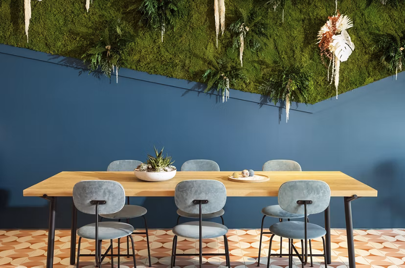 Clubhouse with modern design and comfortable seating at The Charlie Mar Vista Apartments in Los Angeles