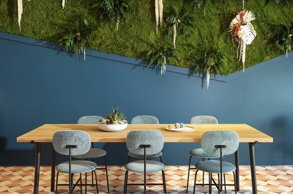 Clubhouse with modern design and comfortable seating at The Charlie Mar Vista Apartments in Los Angeles
