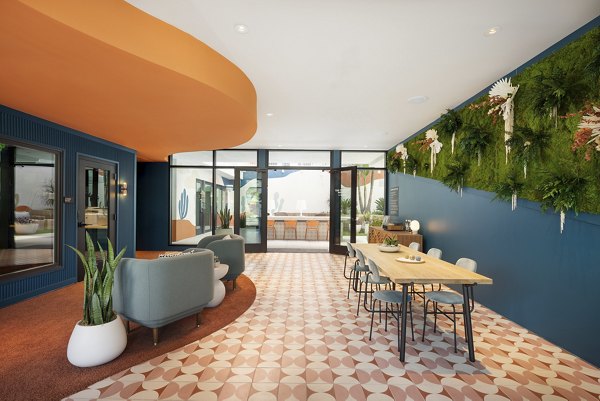 Clubhouse with modern furniture and open layout at The Charlie Mar Vista Apartments