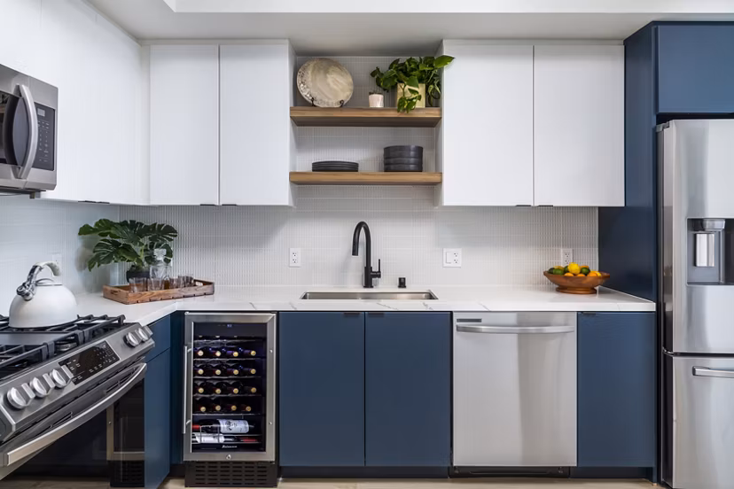 Modern kitchen with stainless steel appliances at The Charlie Mar Vista Apartments