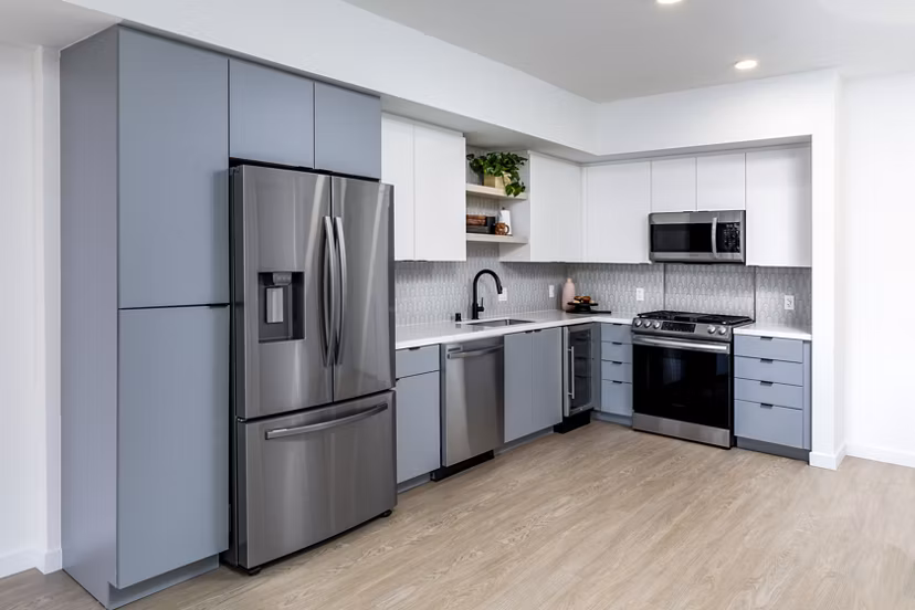 Modern kitchen with stainless steel appliances at The Charlie Mar Vista Apartments