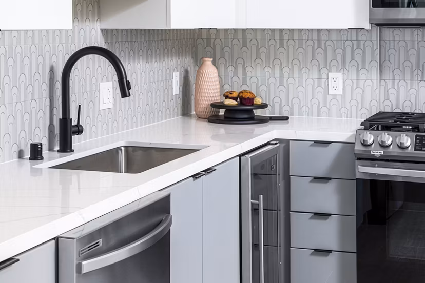 Modern kitchen featuring stainless steel appliances at The Charlie Mar Vista Apartments