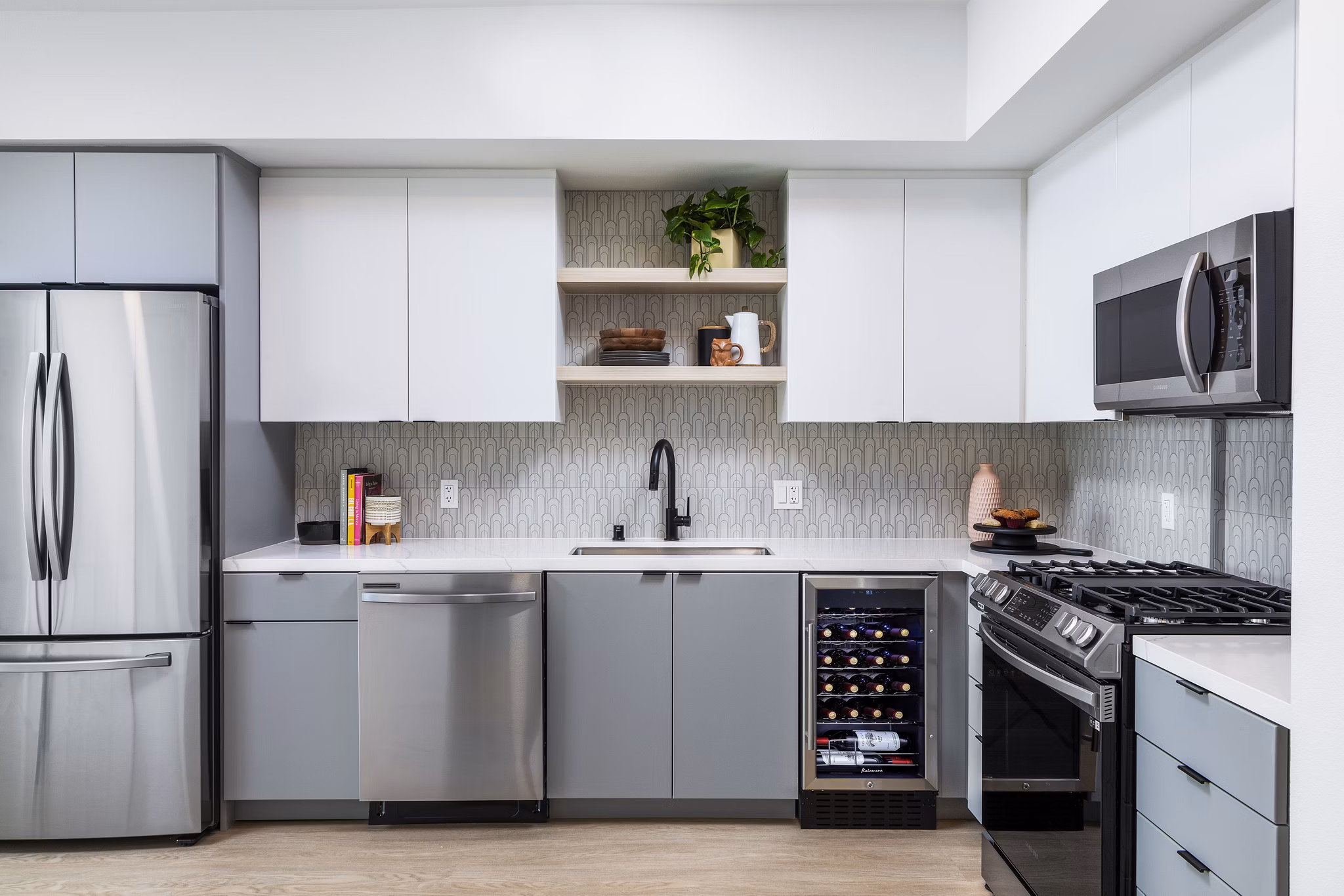 Modern kitchen with stainless steel appliances at The Charlie Mar Vista Apartments