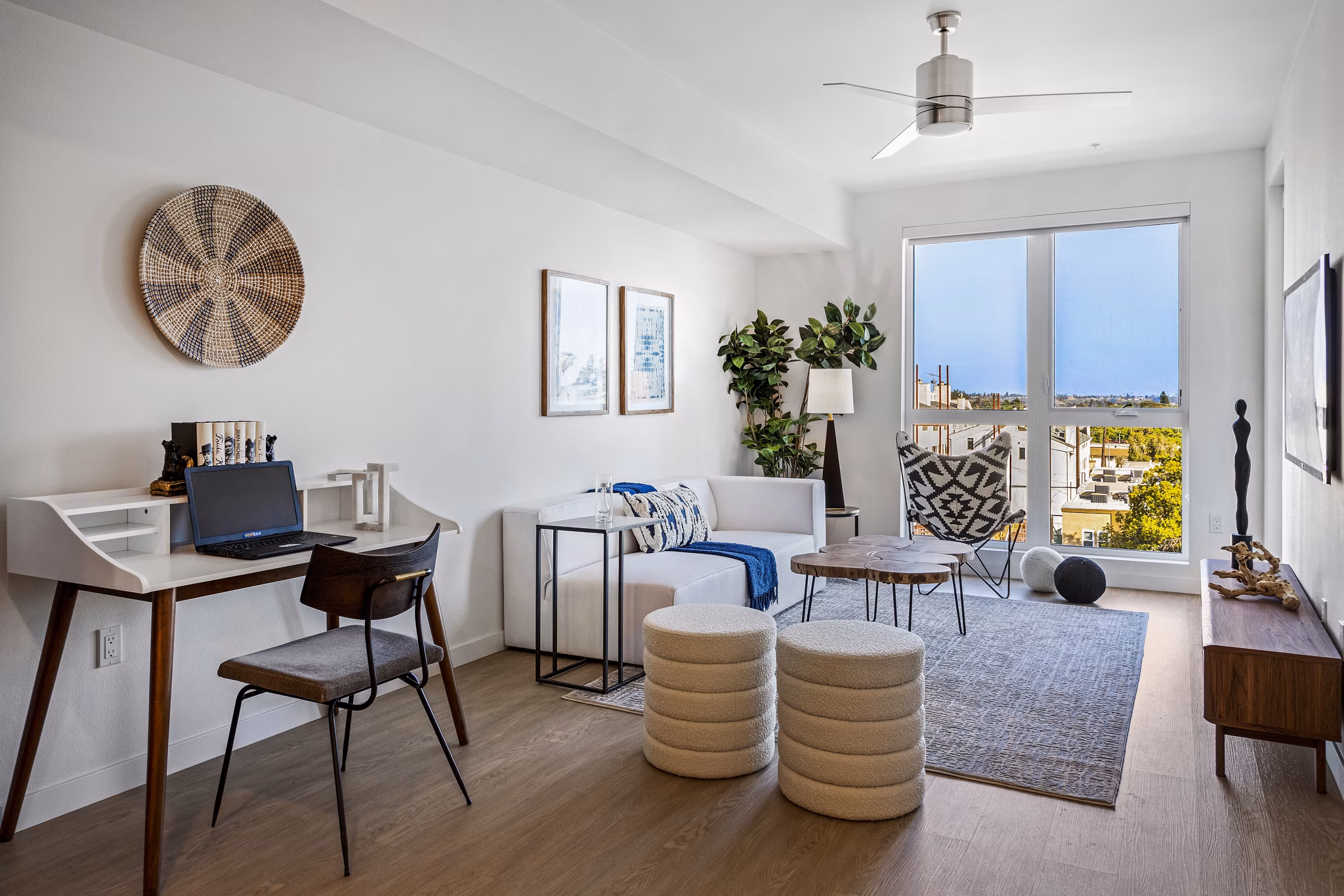 Stylish living room with natural light and modern decor at The Charlie Mar Vista Apartments