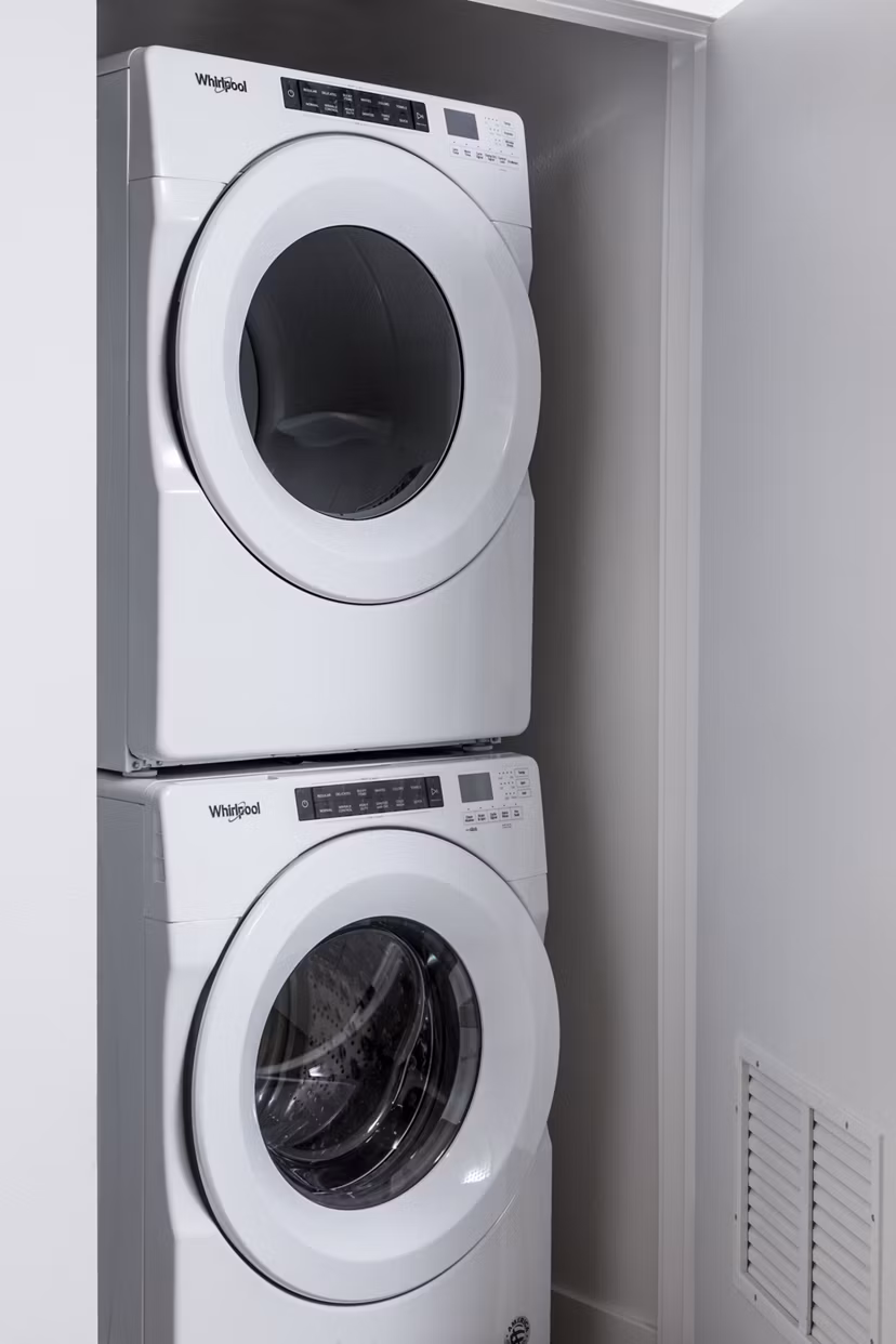 Modern laundry room with state-of-the-art washers and dryers at The Charlie Mar Vista Apartments