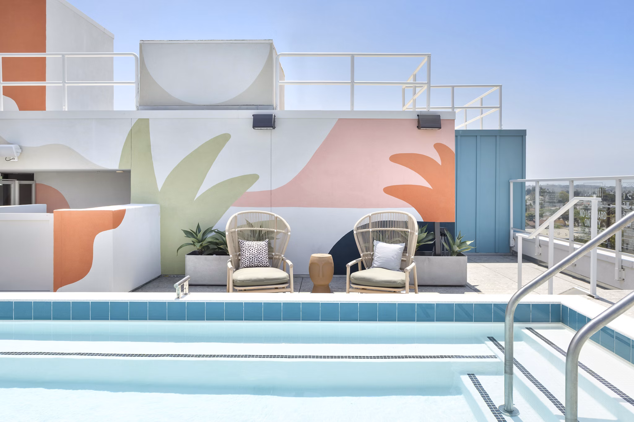 Modern lap pool with sun deck at The Charlie Mar Vista Apartments, a Greystar luxury property in Los Angeles