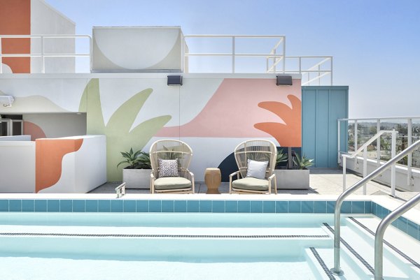 Modern lap pool with sun deck at The Charlie Mar Vista Apartments, a Greystar luxury property in Los Angeles
