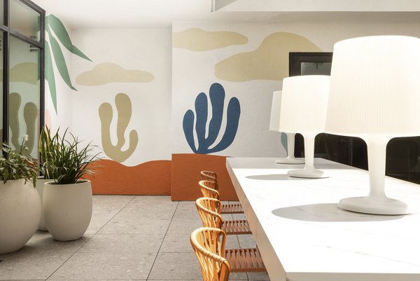 Clubhouse with modern design and open seating area at The Charlie Mar Vista Apartments