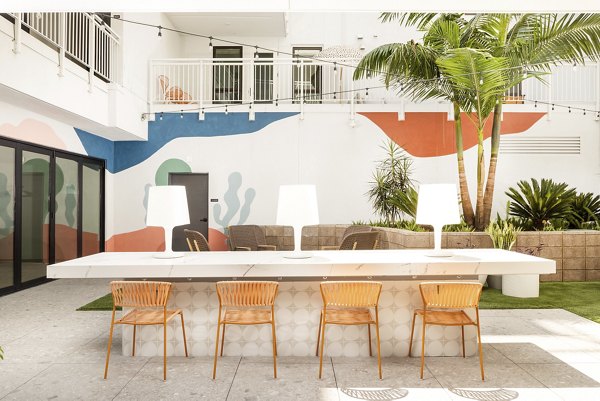 The Charlie Mar Vista: Lush green courtyard at luxury apartments in Los Angeles