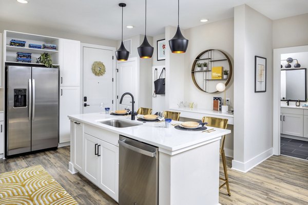 Kitchen featuring modern appliances and sleek countertops at Broadstone Pullman Apartments