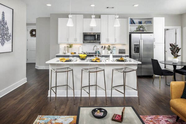 Modern kitchen with stainless steel appliances at Broadstone Pullman Apartments