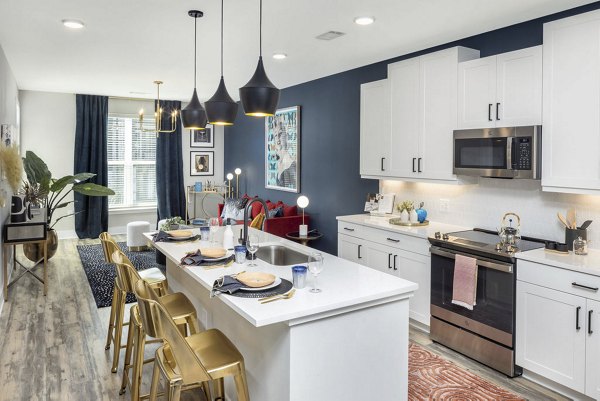 Modern kitchen with stainless steel appliances at Broadstone Pullman Apartments