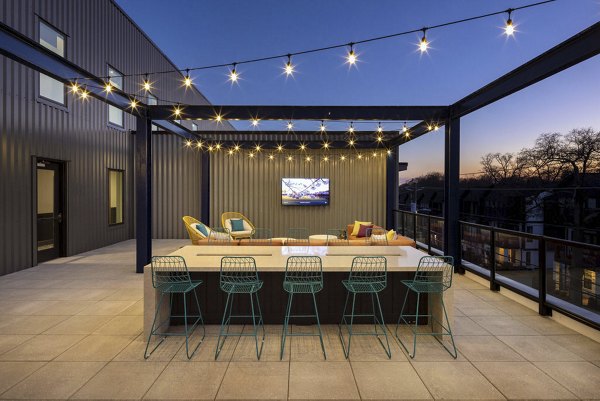 Courtyard featuring lush greenery and seating areas at Broadstone Pullman Apartments