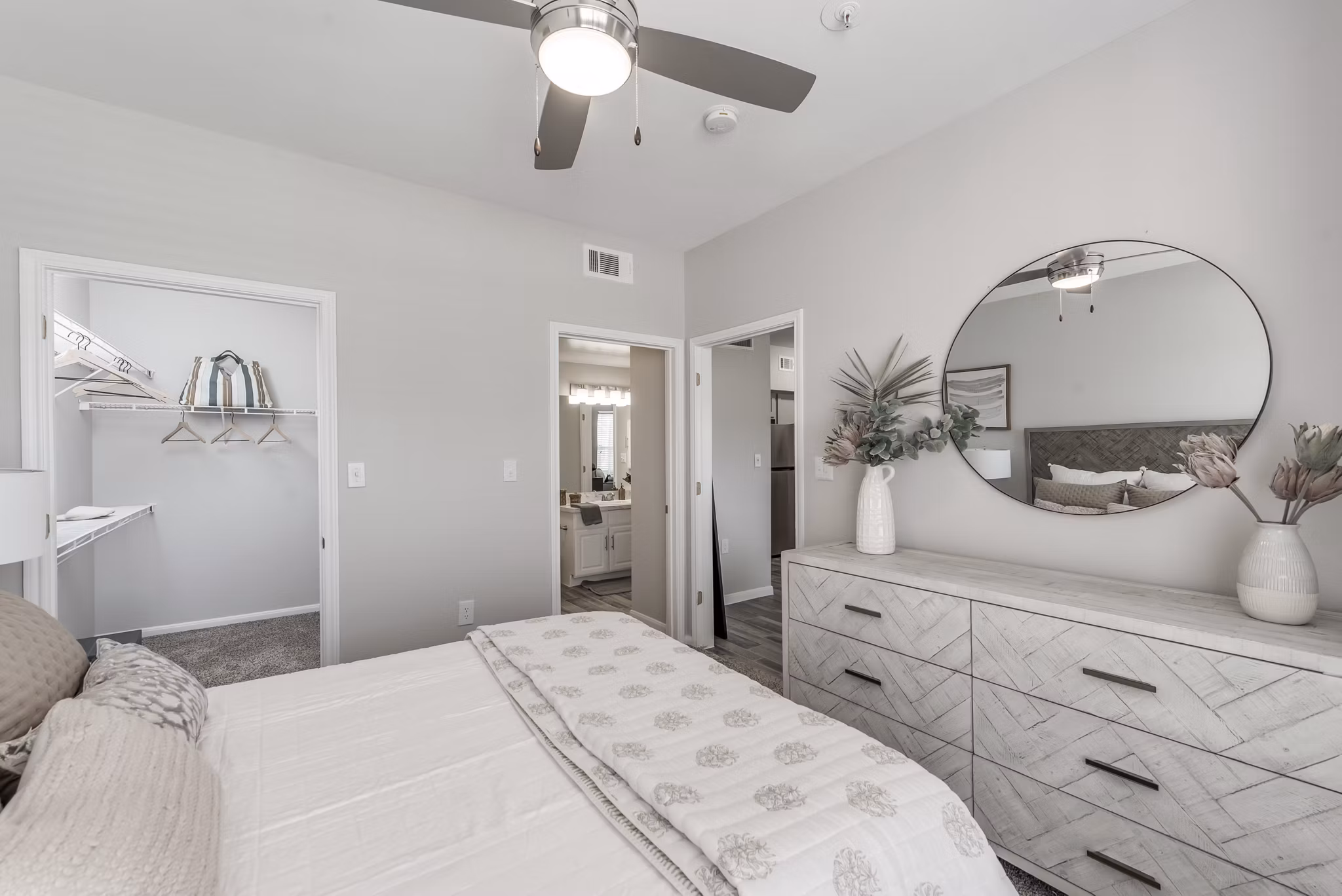 Cozy bedroom with elegant decor in Mirabella Apartments