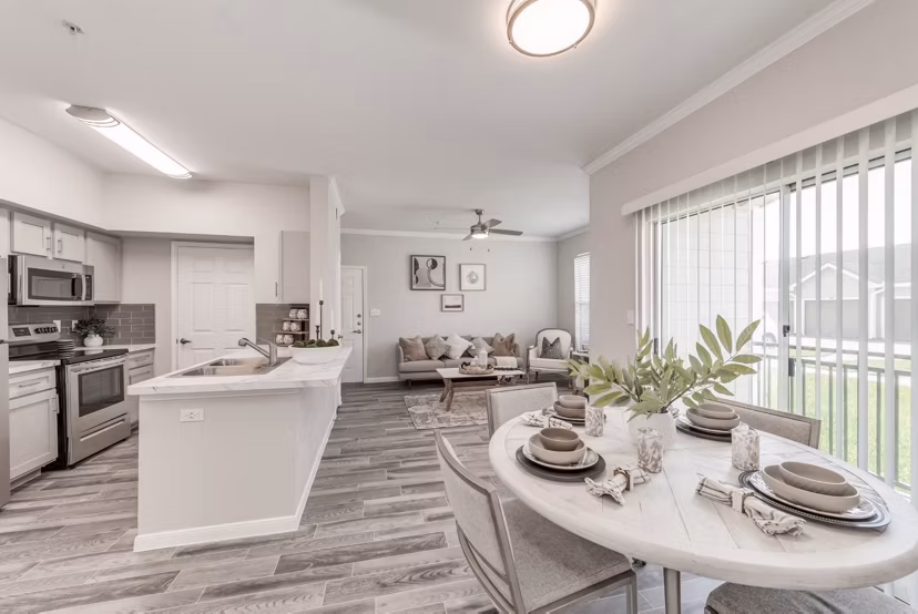 Dining area with modern lighting and sleek furniture at Mirabella Apartments