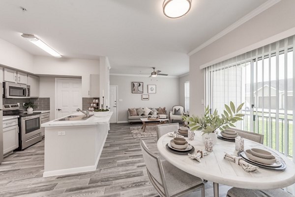 Dining area with modern lighting and sleek furniture at Mirabella Apartments