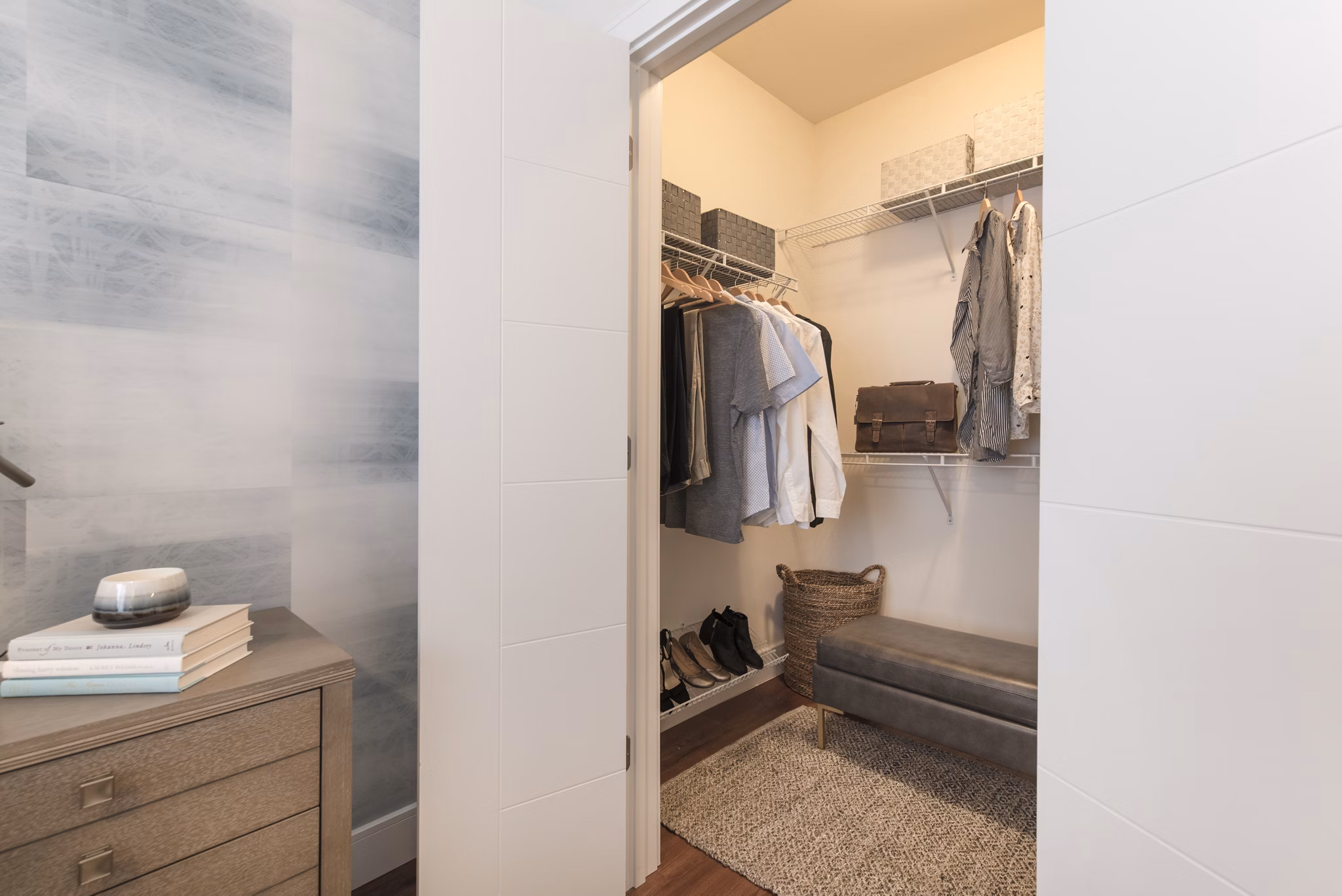 Walk-in closet with custom shelving in The Eliot on Ocean Apartments